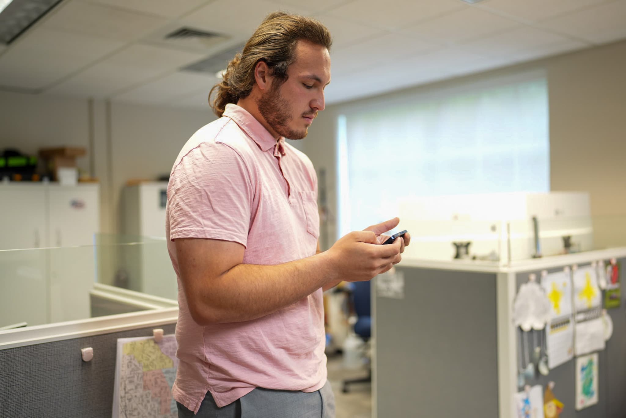 Jorden Shevels, founder of Elev8 Digital, working from his phone